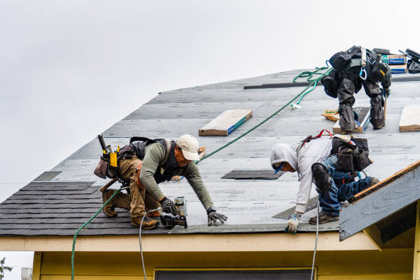 Professional Roofing technician working in East Islip, NY